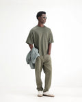 Rare Rabbit Men's Arvi Green Cotton Plain Dond Carrot Fit Jeans