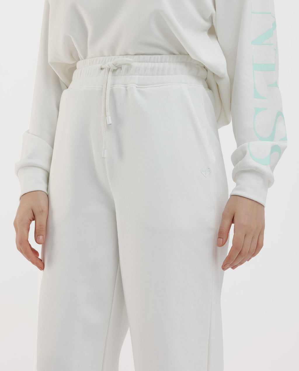 Rareism Women's Pazoo F1 Off White Cotton Blend Plain Ankle Length Flared Track Pant