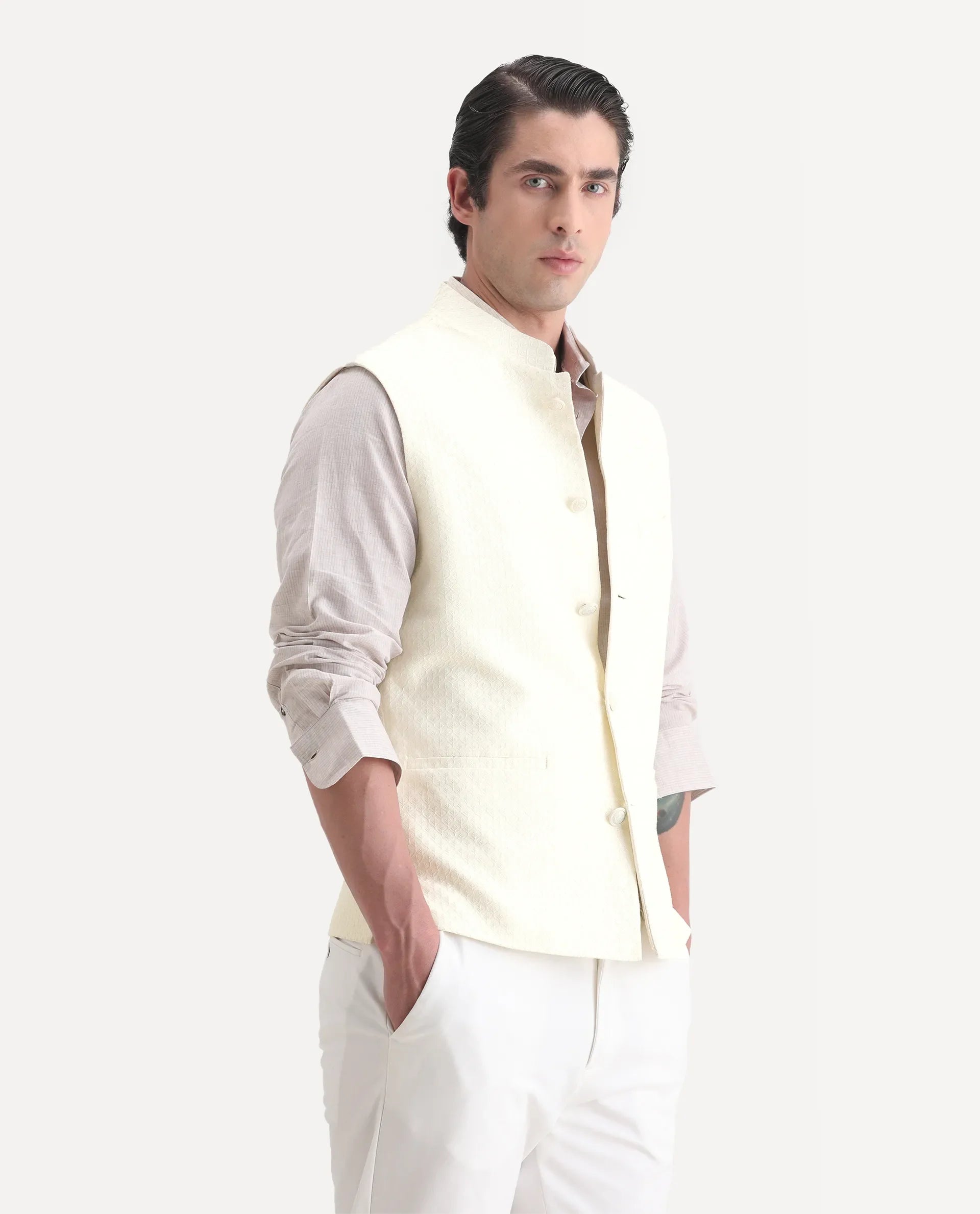 Rare Rabbit Men's Guild Festive Lasmos B1 Off White Polyester Blend Embroidered Regular Fit Sleeveless Mandarin Collar Bandhgala Rare Rabbit Men's Lasmos-B1 Beige Polyester Blend Embroidered Regular Fit Sleeveless Mandarin Collar Bandhgala Nehru Jacket